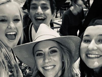 Aimee Preston is wearing a cowboy hat while Evan Todd, Claire Klopper, and Katie Schachter are smiling for the camera.